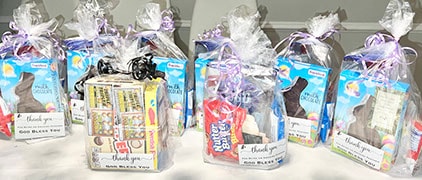 Handcrafted thank-you gift baskets made for school district staff — wrapped with care and God Bless You tags