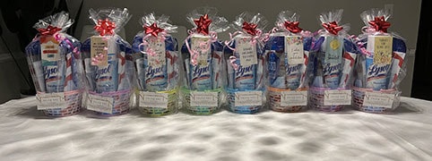 Lysol and essential supply gift baskets lined up for school district staff appreciation